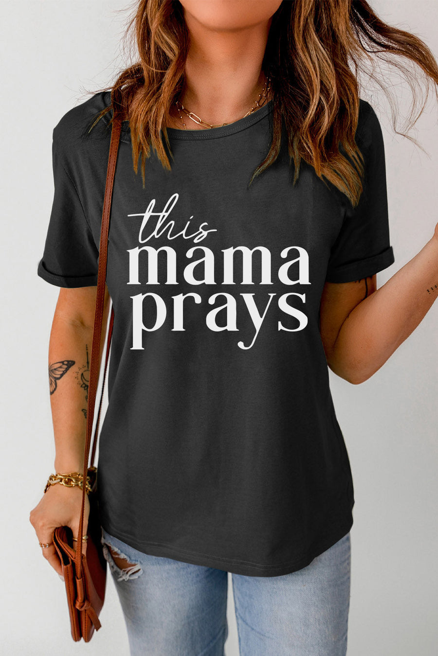 Black maternity t-shirt with white scripted text that says "this mama prays