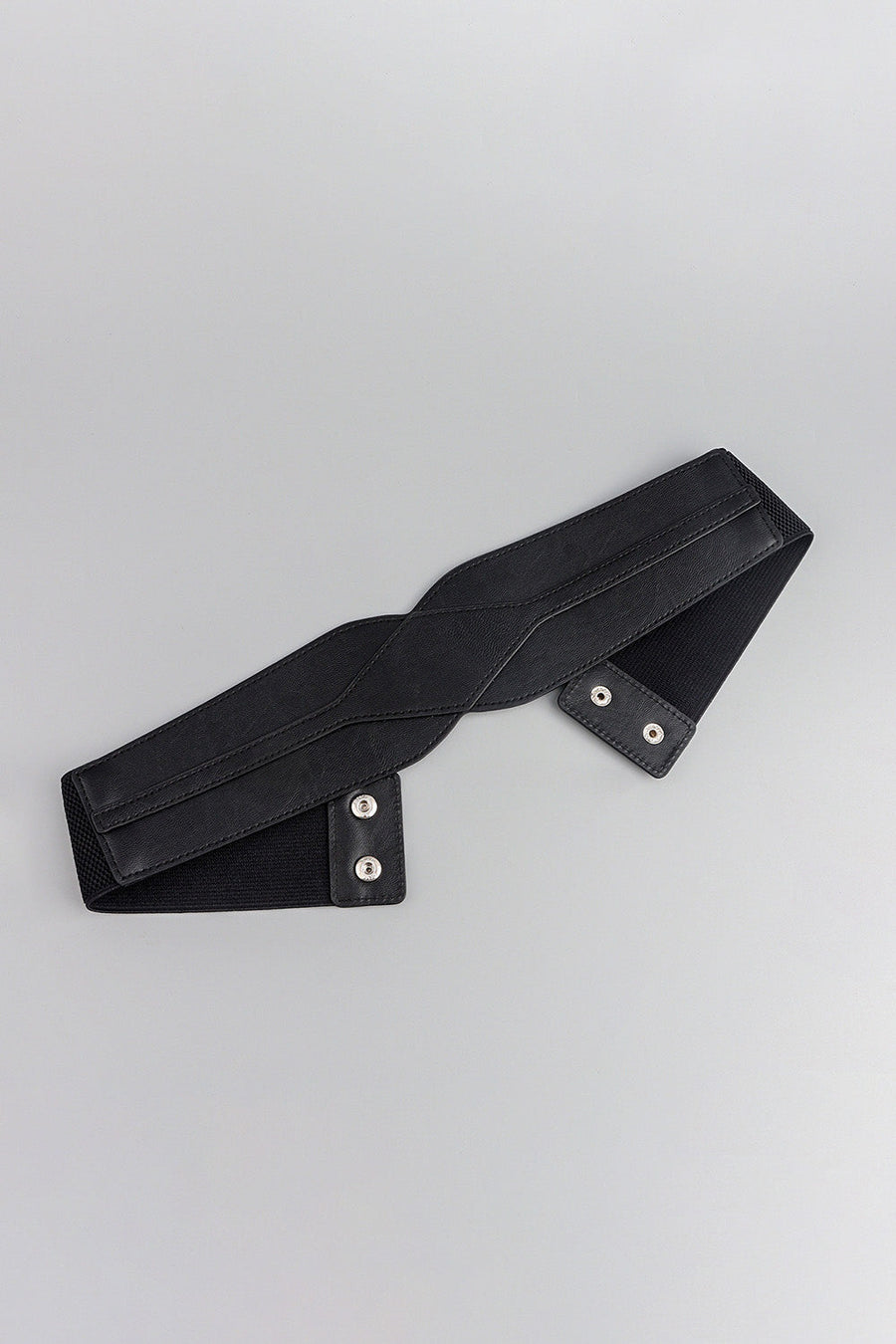 Black elastic belt with sculpted faux leather overlay and silver snap closures