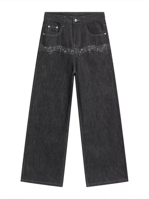 Loose fit dark wash cotton jeans with white embroidered musical notes across the front.