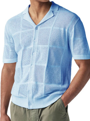 Light blue knit polo shirt with geometric pattern and button front