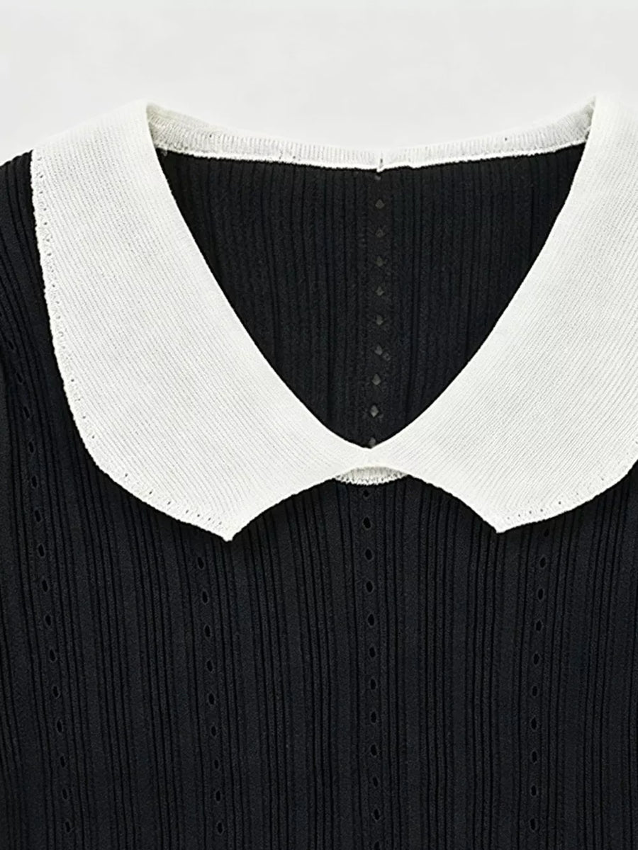 Black maternity t-shirt with white frill collar and ribbed texture.