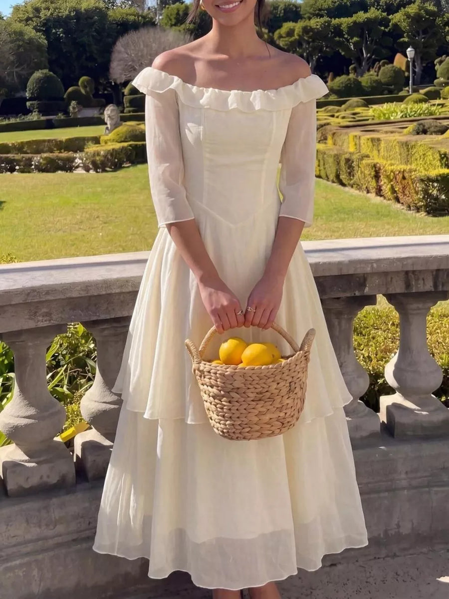 Cream ruffled off-shoulder midi dress with tiered skirt and airy fabric.