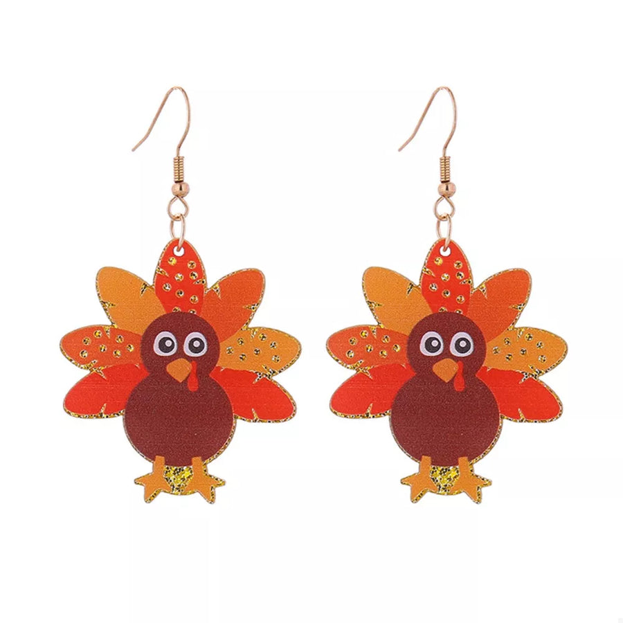 Festive turkey dangle earrings in red, orange, and yellow acrylic with gold accents.