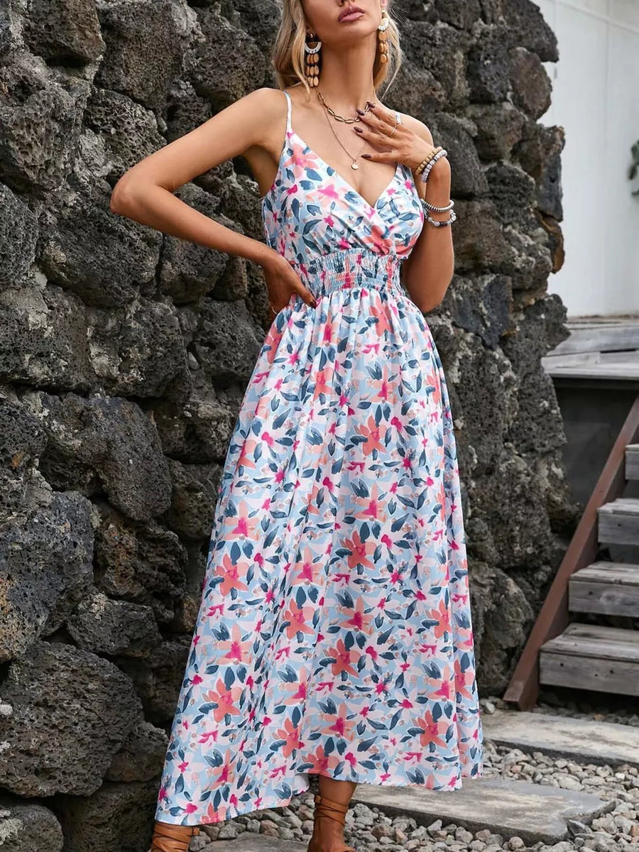 Maxi dress with floral print, V-neck, spaghetti straps, and elastic waist.
