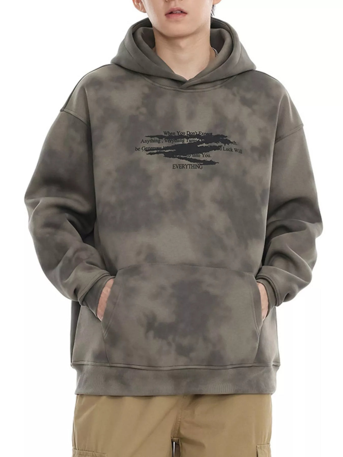 Oversized tie-dye hoodie in Cement Gray with graphic print and front pocket.