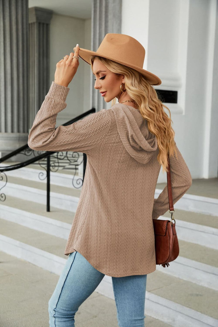 Textured henley hooded tunic in camel with long sleeves and a relaxed fit.