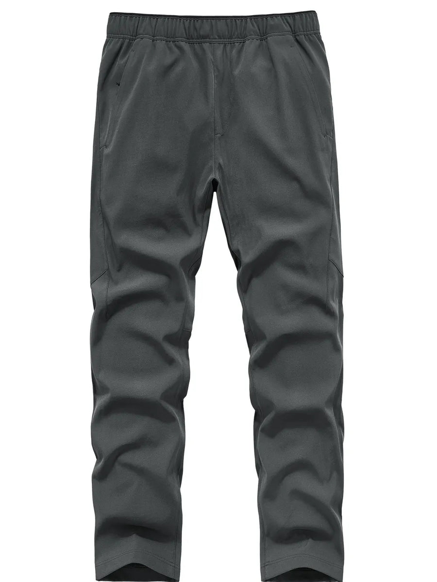 Men's grey sweatpants with elastic waistband and pockets.