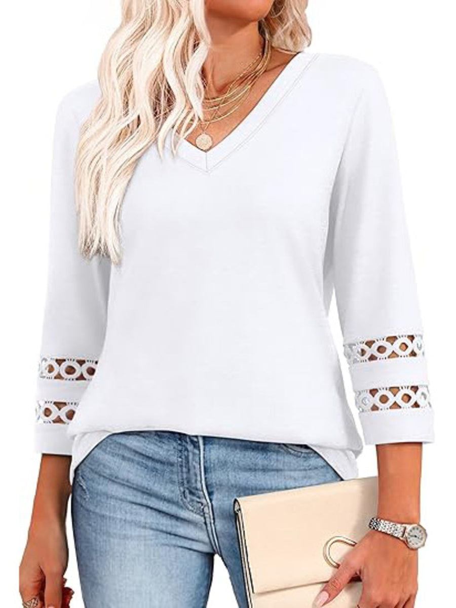 White 3/4 sleeve t-shirt with V-neck and cutout detail on sleeves.