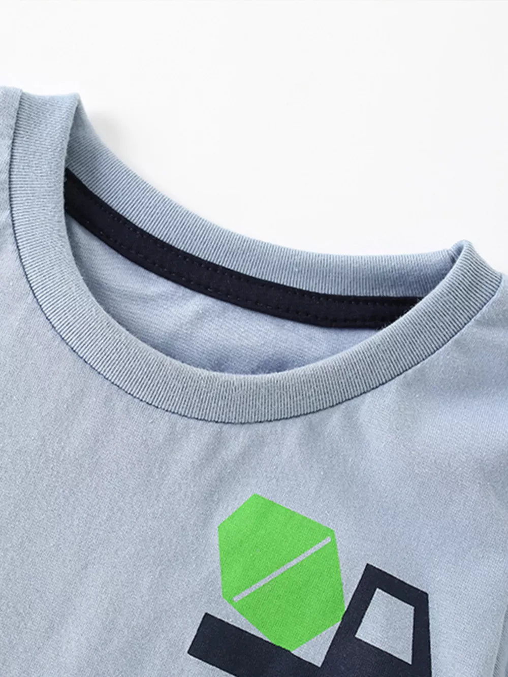 Light blue cotton toddler t-shirt with a dark blue trim collar and a whimsical truck graphic.