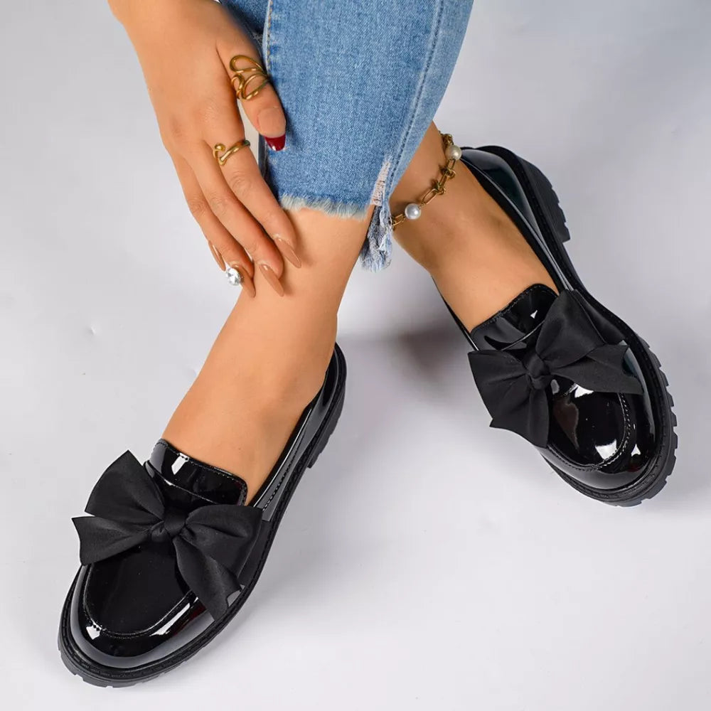 Black patent loafers with large bow detail, casual flat shoes