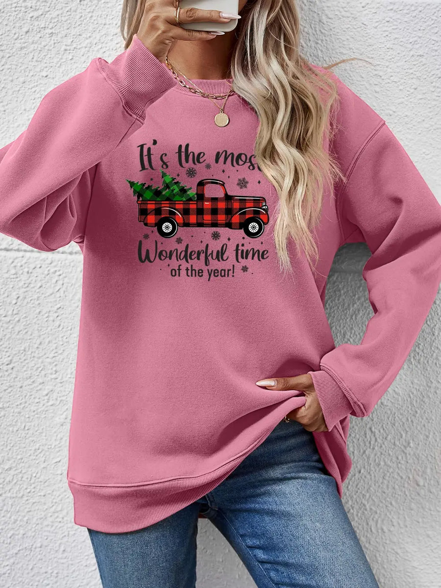 Blush Pink sweatshirt with Christmas truck graphic and text.