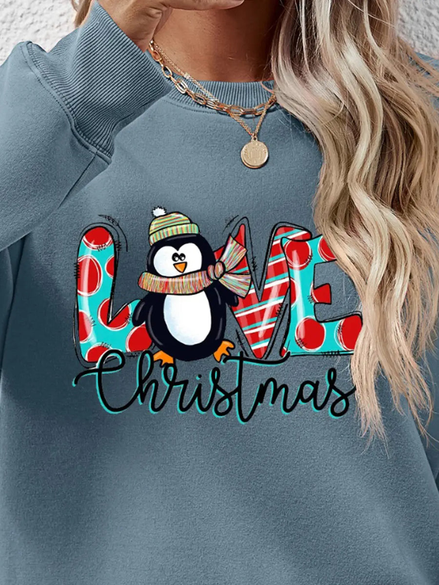 Festive penguin graphic sweatshirt in Air Force Blue with "LOVE Christmas" text and holiday patterns.