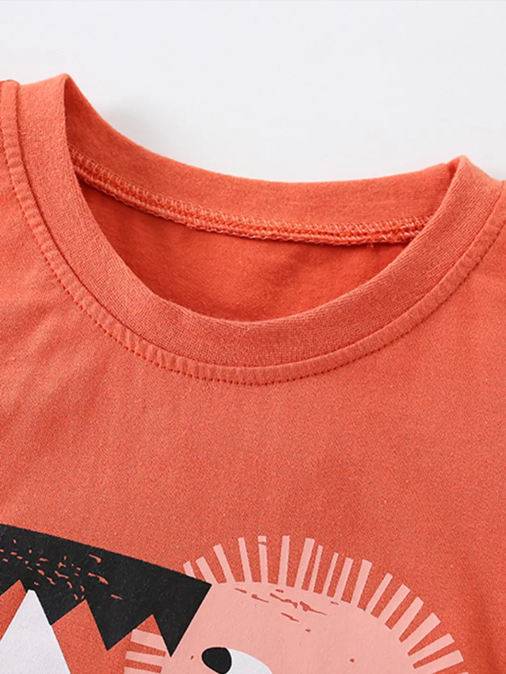 Coral cotton toddler t-shirt with a graphic print and crew neck.