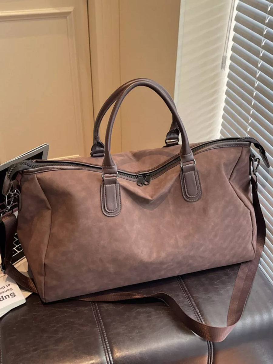 Chocolate duffel bag with dual handles and adjustable strap, large capacity travel bag.