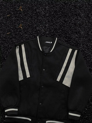 Black bomber jacket with white stripe accents on sleeves and collar, buttoned front.