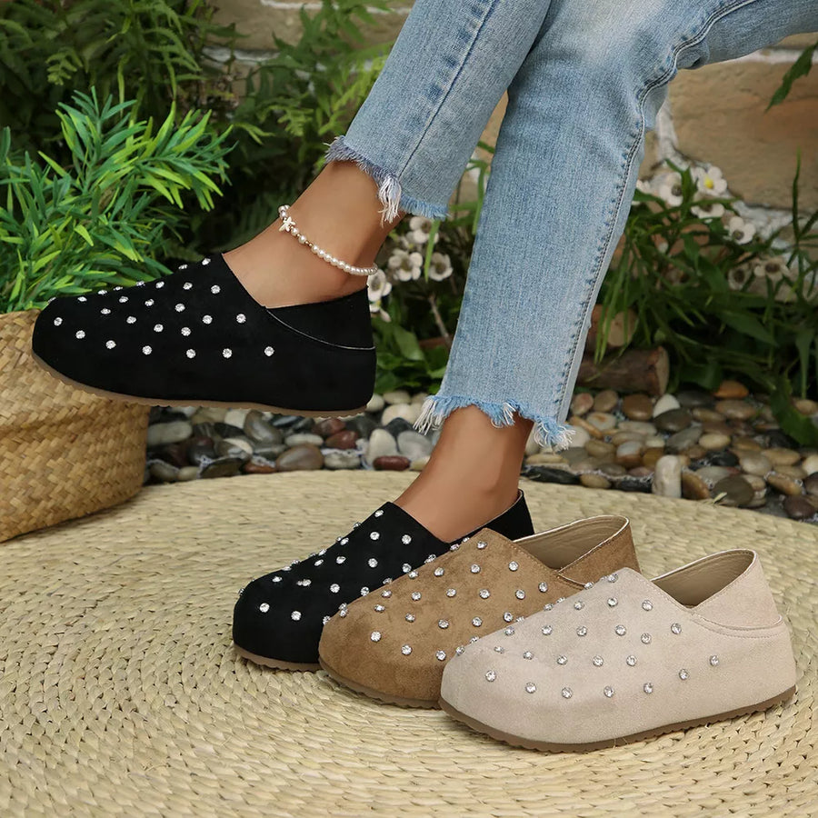 slip-ons in black featuring rhinestone embellishment and flats fit