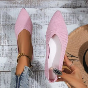 Pink knit pointed toe flats with a low cut vamp.