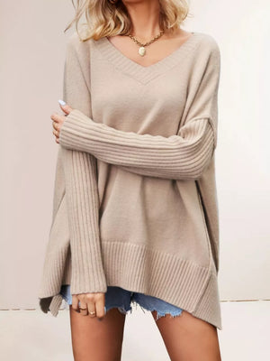 100% polyester Care instructions: Machine wash cold v-neck sweater in Apricot with relaxed silhouette