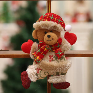 Red plush teddy bear Christmas ornament with Santa hat, scarf, mittens, and festive outfit.