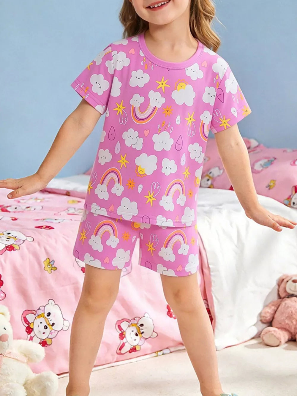 Girls' pink long johns set with clouds and rainbows pattern
