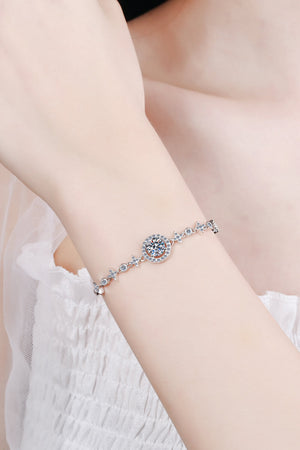 Silver moissanite bracelet with celestial halo design and star accents.