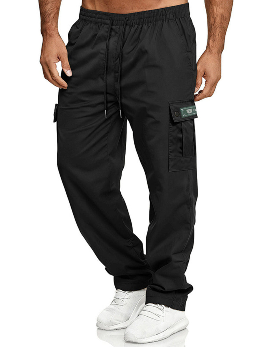 Black cargo pants with adjustable waist, drawstring, and side pocket detail.