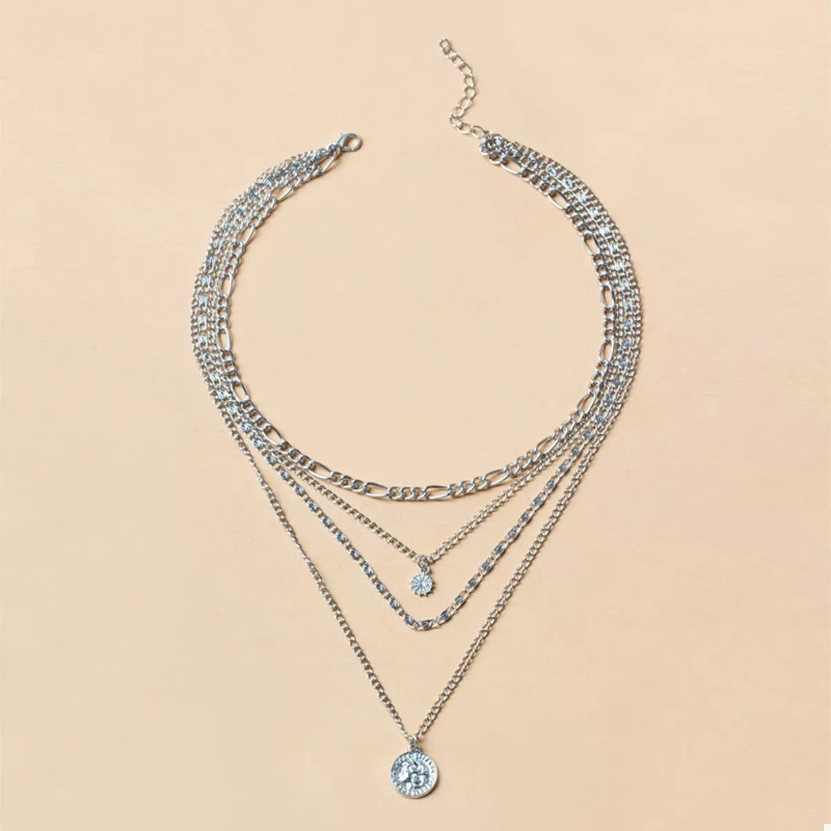 Silver layered necklace with coin pendant and crystal charm