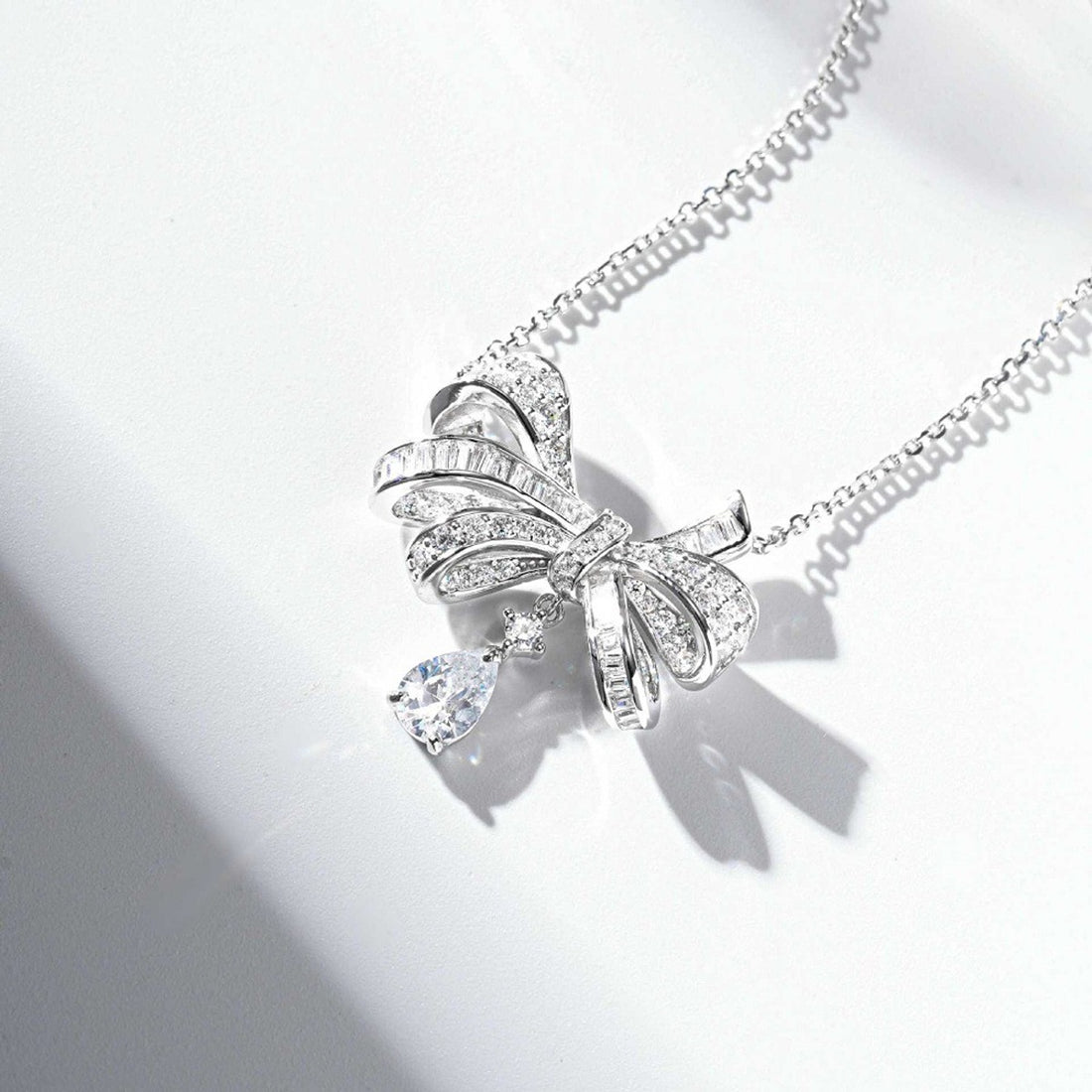 necklace in silver with bow design and princess