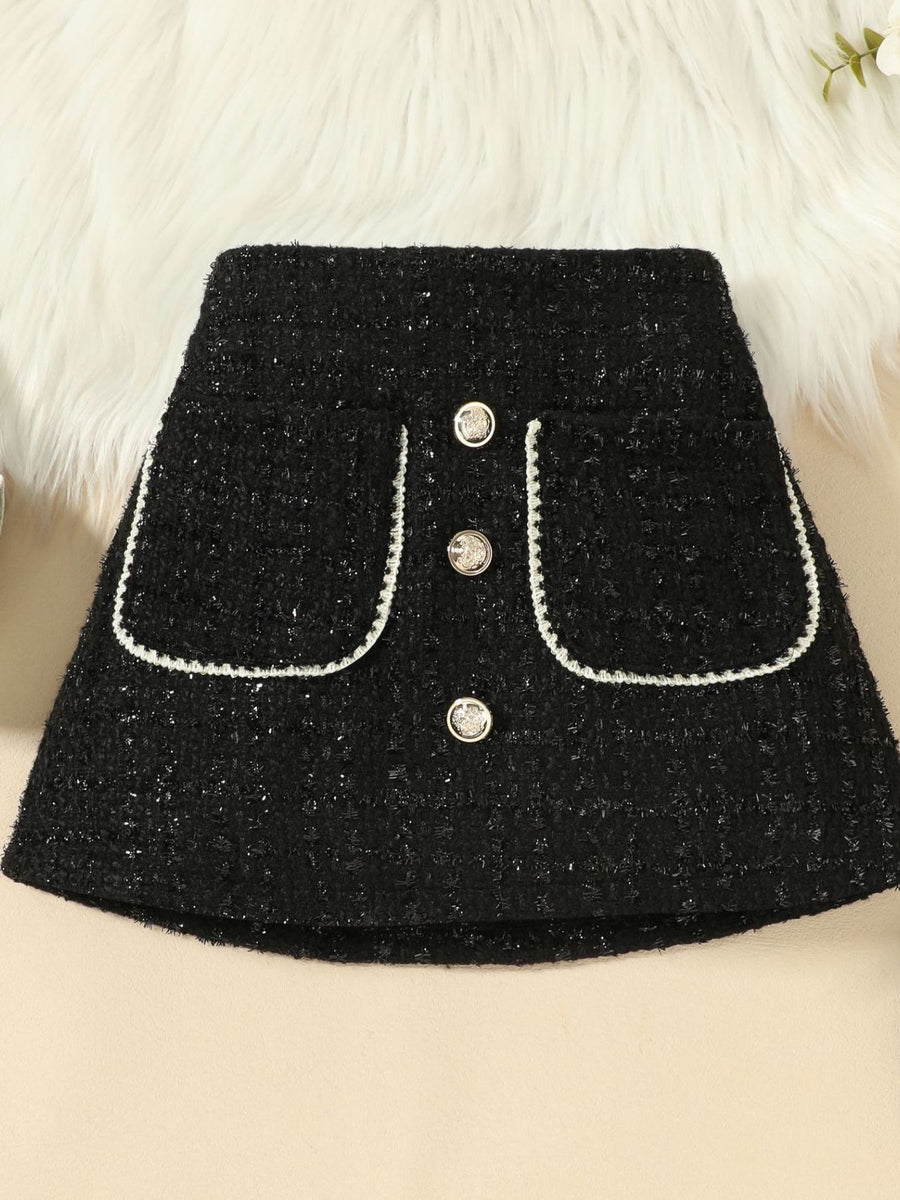 Black tweed skort with decorative buttons and white trim pockets.