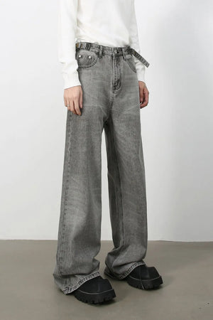 Wide-leg dark gray washed denim jeans with belt and a relaxed fit.