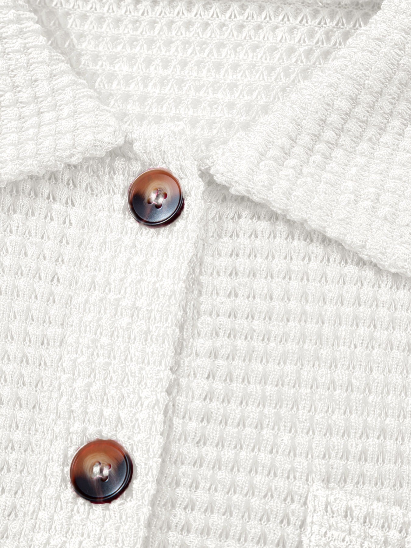 White waffle knit button-up shirt with tortoise shell buttons and chest pocket detail.