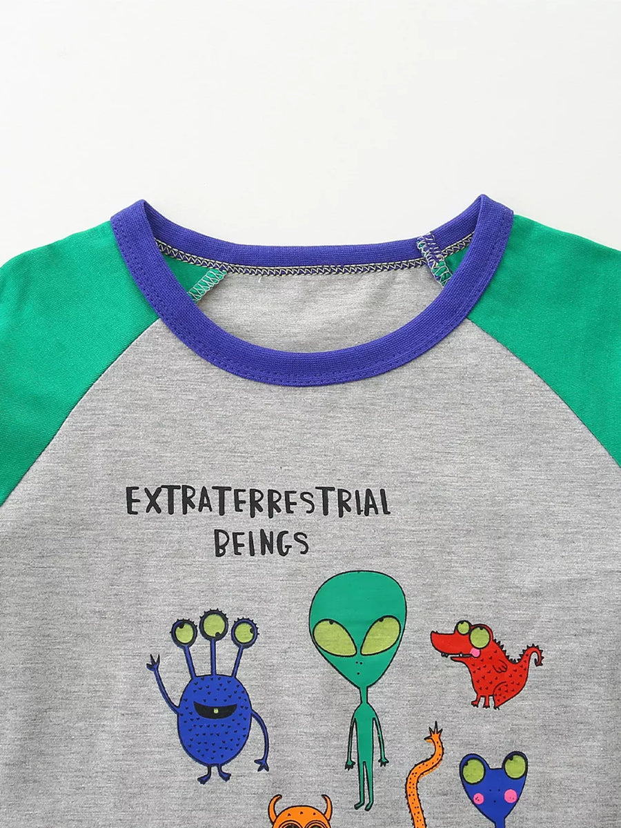 Gray raglan t-shirt with green sleeves and a blue neckline, featuring alien graphics and text.