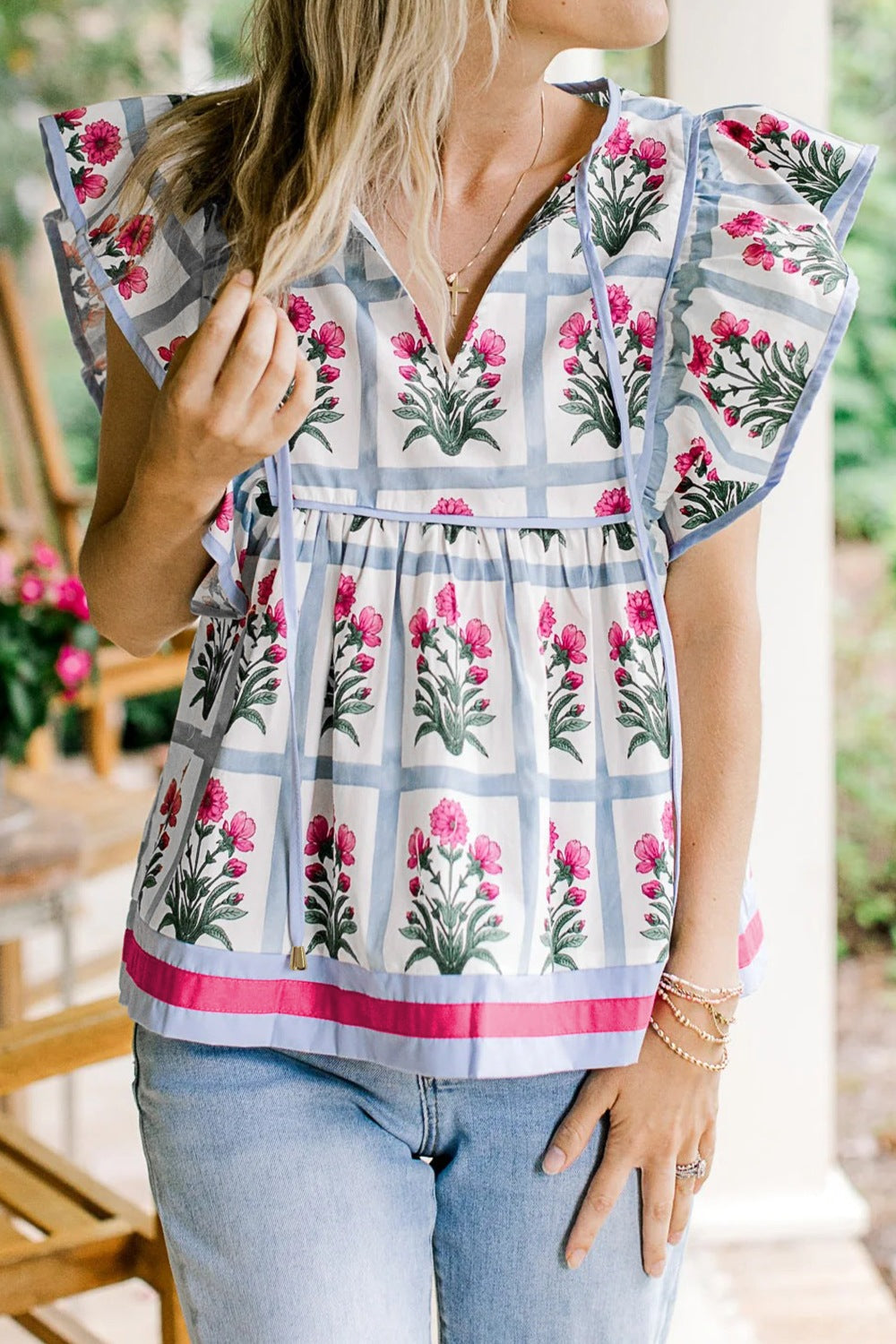 Women's ruffle sleeve blouse with floral print and tie neck