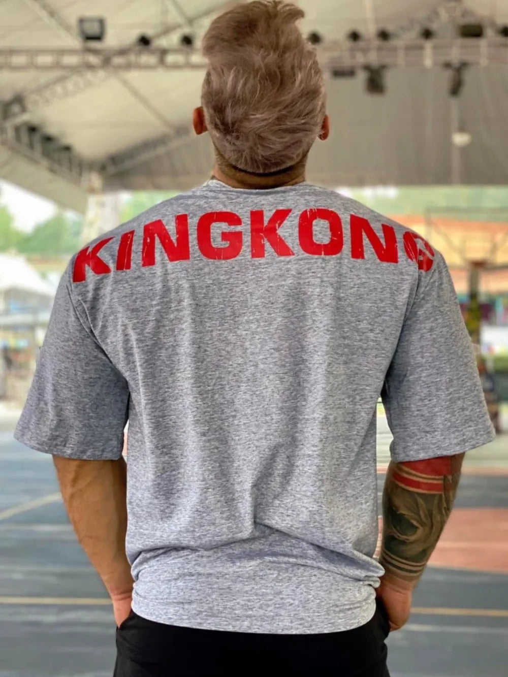 Gray oversized t-shirt with bold red KINGKONG graphic on back.