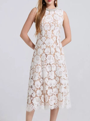 White lace dress with embellished neckline and scalloped hem.