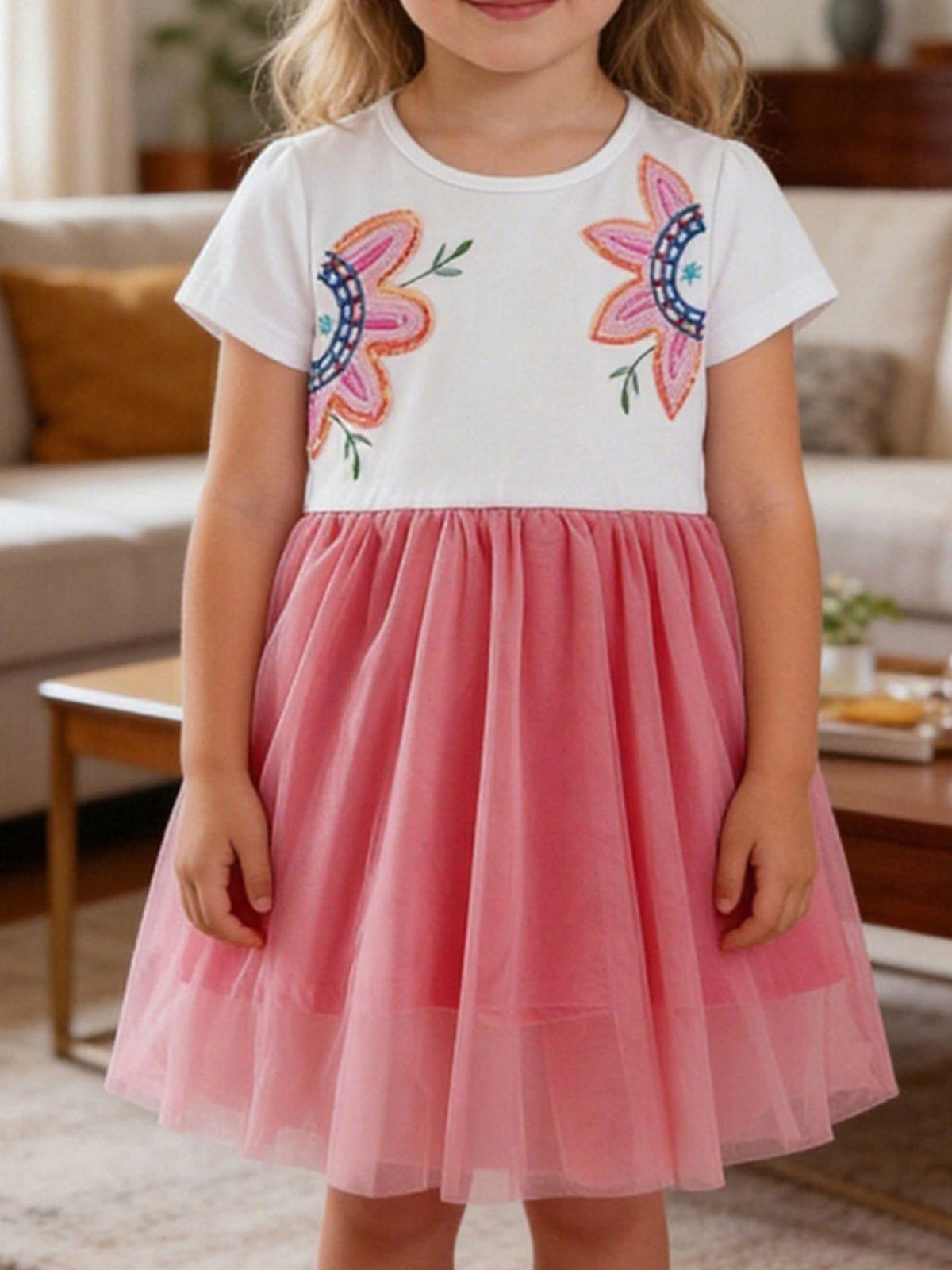 Toddler dress with white top, embroidered flowers, and pink tulle skirt.