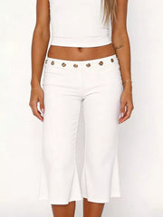 White maternity capri pants with flared hem and grommet detail at waist
