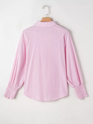 Pink striped collared shirt with smocked cuffs and bishop sleeves.