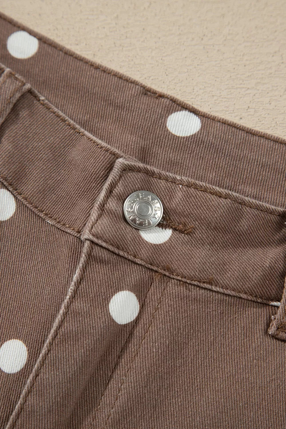 brown jeans featuring pocketed and polka dot