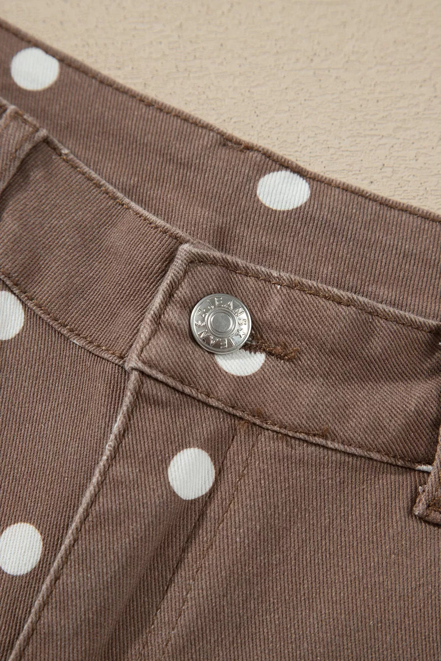 brown jeans featuring pocketed and polka dot