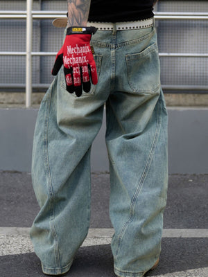 Men's light wash distressed oversized jeans with a relaxed fit and visible stitching detail.