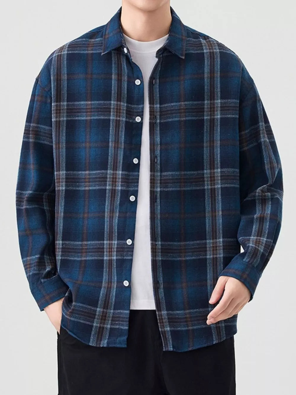 Relaxed fit men's plaid button-up shirt in blue coffee grid cotton with collared neckline.