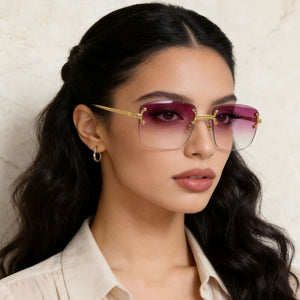 Rimless gradient tinted sunglasses with gold accents and lilac lenses.