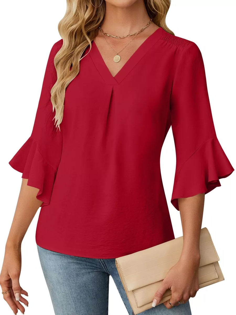 Red V-neck ruffle sleeve blouse with pleated front detail.