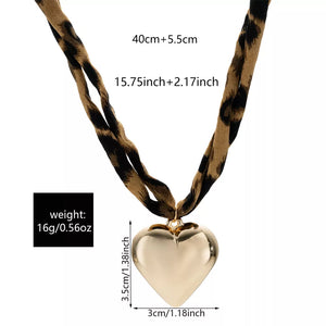 necklace in tan with leopard and pendant