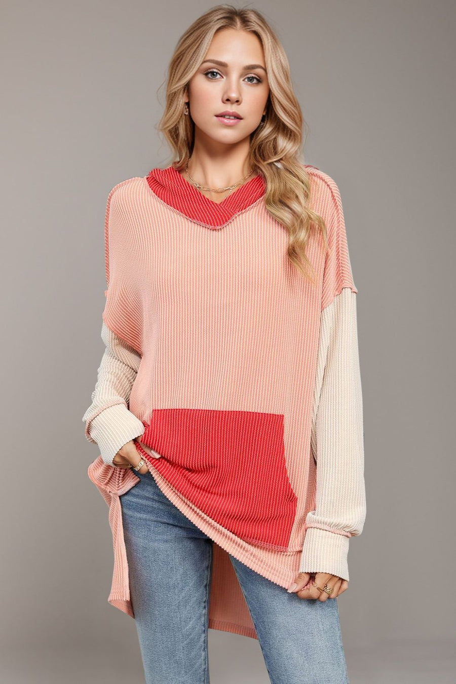 Pink and cream waffle knit hoodie with red pocket and v-neck