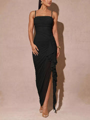 Black ruched spaghetti strap dress with a ruffled high slit hem.