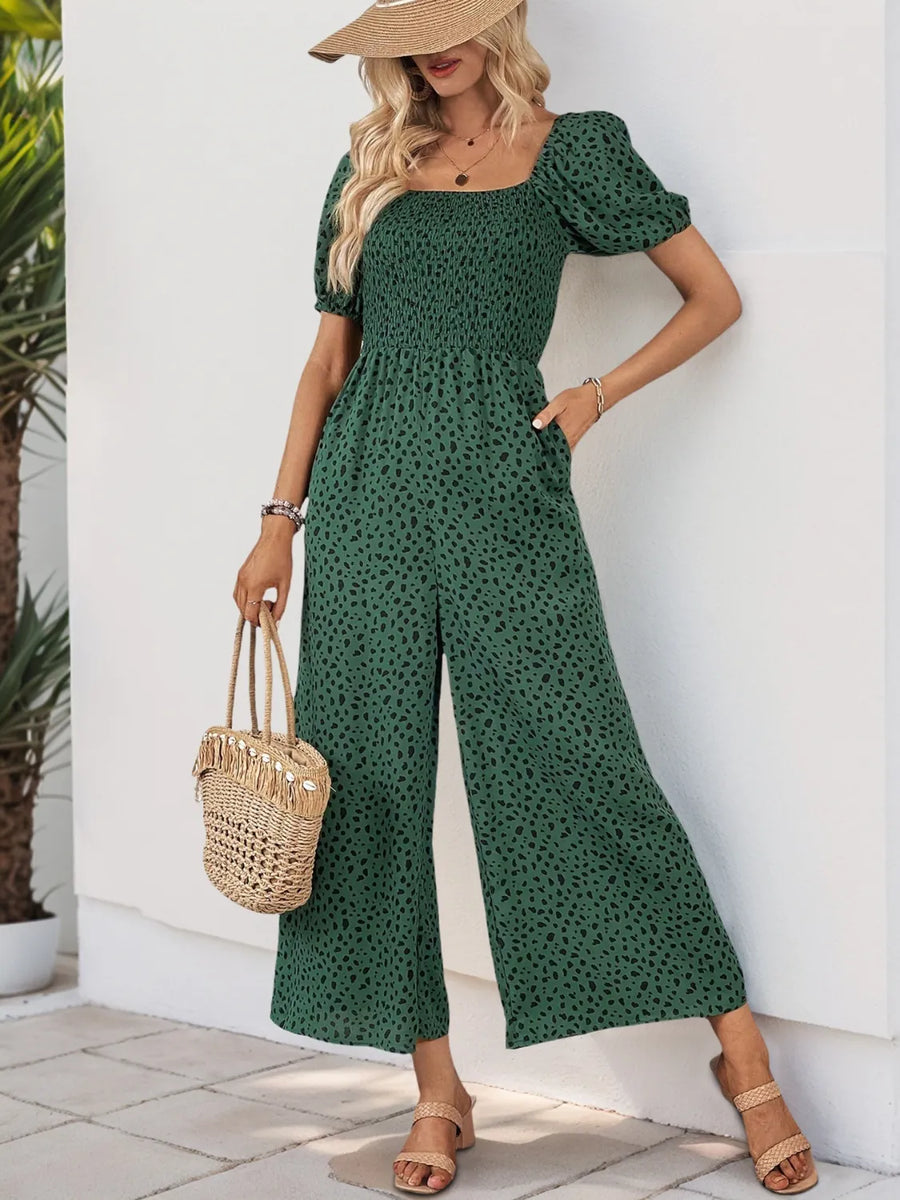 Dark Green leopard print jumpsuit with smocked bodice and wide legs.