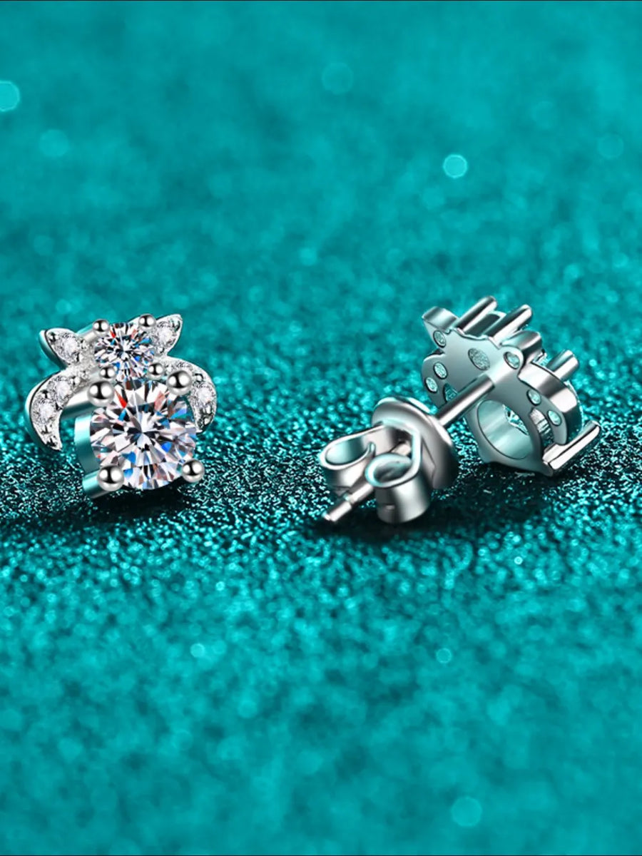Silver moissanite floral cluster stud earrings with sparkling center stone.