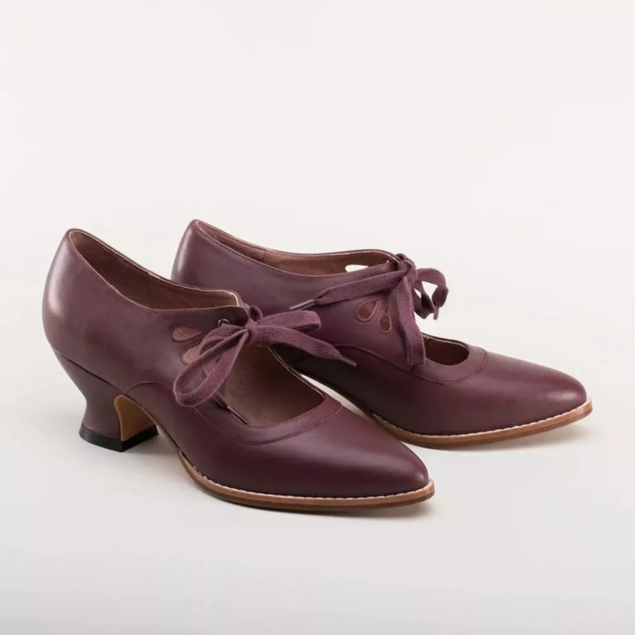 Burgundy leather lace-up Mary Jane heels with pointed toe and cut-out detail